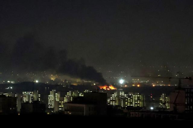 Smoke and fire rise from the site of airstrikes at Mehrabad International Airport in Tehran on March 7, 2026. Israel said on March 7 it had launched "broad-scale" strikes on targets in Tehran, as the Iranian state broadcaster reported an explosion in the western part of the city. (Photo by ATTA KENARE / AFP)