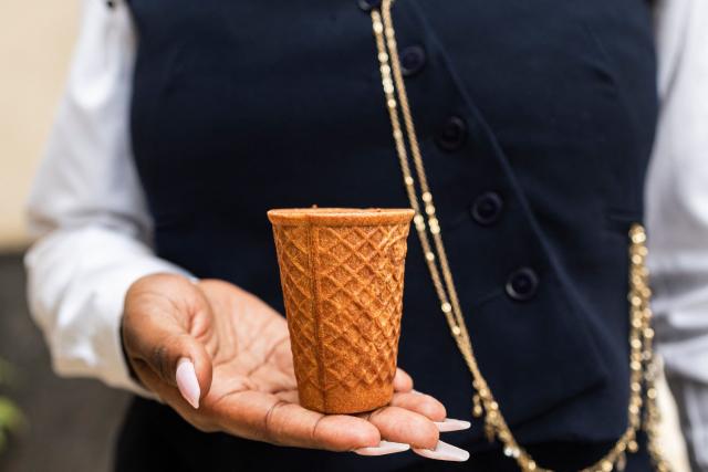 Kenyan innovator and ecopreneur, Sheryl Mboya, 26, poses with one of her innovations, an edible cup; an idea born of her dislike of plastic pollution in Nairobi on March 6, 2026. Christened 'snackuit', the law graduate's patented edible tableware is her answer to single-use plastics pollution and is alot safer for the general environment due to it's biodegradability.Developed under GreenX Telemechanics Limited, a technology and innovation developer whose core objective is to come up with innovative solutions such as Snackuit, that not only address challenges mankind face but also contribute to climate action. (Photo by Tony KARUMBA / AFP)