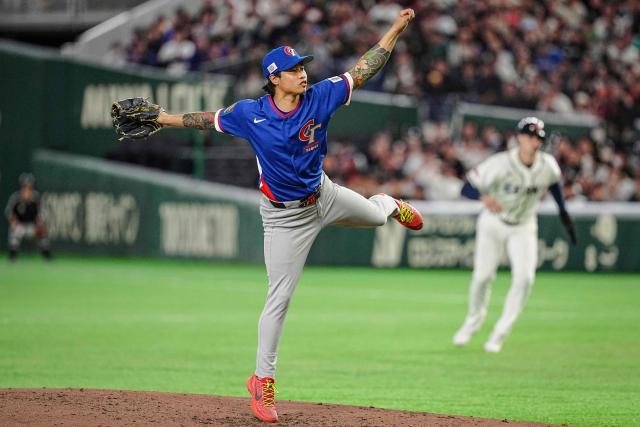 Taiwan's Yu-Min Lin pitches during the World Baseball Classic (WBC) Pool C game between Taiwan and Czech Republic at the Tokyo Dome in Tokyo on March 7, 2026. (Photo by Yuichi YAMAZAKI / AFP)