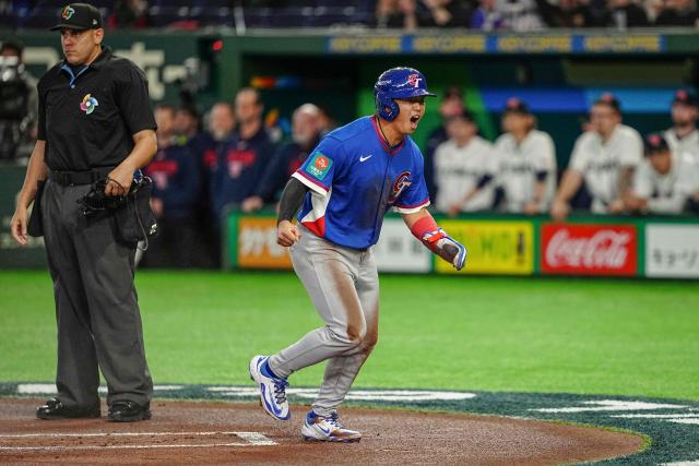 Taiwan's Tsung-Che Cheng celebrates scoring a run during the World Baseball Classic (WBC) Pool C game between Taiwan and Czech Republic at the Tokyo Dome in Tokyo on March 7, 2026. (Photo by Yuichi YAMAZAKI / AFP)