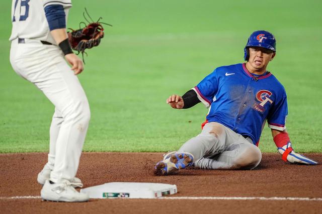 Taiwan's Tsung-Che Cheng steals third base during the World Baseball Classic (WBC) Pool C game between Taiwan and Czech Republic at the Tokyo Dome in Tokyo on March 7, 2026. (Photo by Yuichi YAMAZAKI / AFP)