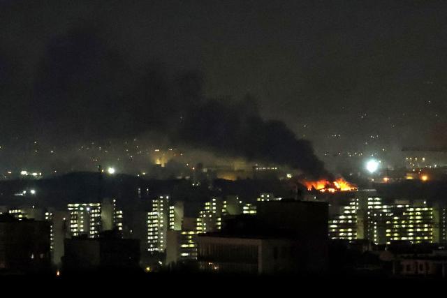 TOPSHOT - Smoke and fire rise from the site of airstrikes at Mehrabad International Airport in Tehran on March 7, 2026. Israel said on March 7 it had launched "broad-scale" strikes on targets in Tehran, as the Iranian state broadcaster reported an explosion in the western part of the city. (Photo by ATTA KENARE / AFP)