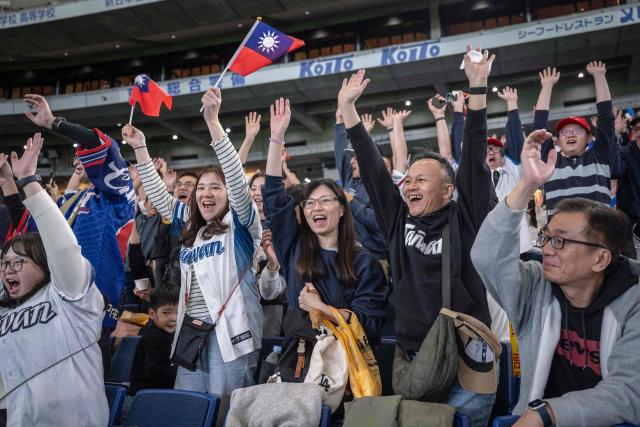 Taiwan's fans cheer in the stands during the World Baseball Classic (WBC) Pool C game between Taiwan and Czech Republic at the Tokyo Dome in Tokyo on March 7, 2026. (Photo by Yuichi YAMAZAKI / AFP)