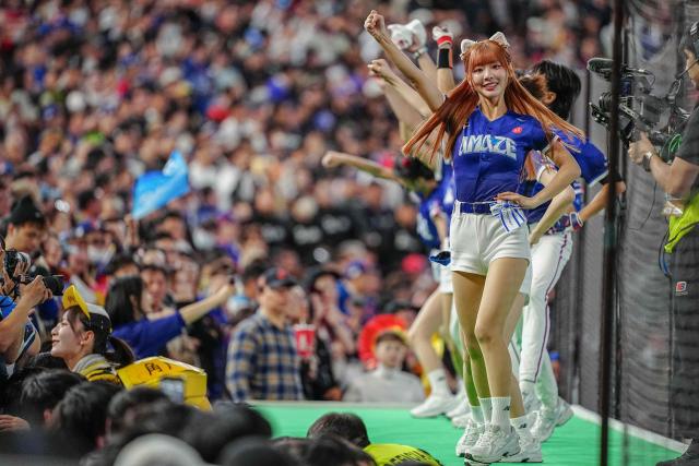 Members of Taiwan's national cheerleading group 'CT AMAZE' cheer during the World Baseball Classic (WBC) Pool C game between Taiwan and Czech Republic at the Tokyo Dome in Tokyo on March 7, 2026. (Photo by Yuichi YAMAZAKI / AFP)