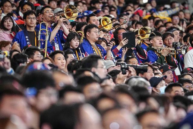 Taiwan's fans cheer in the stands during the World Baseball Classic (WBC) Pool C game between Taiwan and Czech Republic at the Tokyo Dome in Tokyo on March 7, 2026. (Photo by Yuichi YAMAZAKI / AFP)