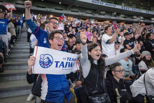 Taiwan's fans cheer in the stands during the World Baseball Classic (WBC) Pool C game between Taiwan and Czech Republic at the Tokyo Dome in Tokyo on March 7, 2026. (Photo by Yuichi YAMAZAKI / AFP)