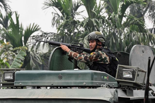An army personnel keeps watch outside a counting centre in Damak, Jhapa district, on March 7, 2026, two days after Nepal's parliamentary election. Nepal's centrist party of rapper-turned-politician Balendra Shah looked set to win by a landslide in parliamentary polls, according to Election Commission trends March 7, but with counting still far to go. (Photo by Prakash MATHEMA / AFP)