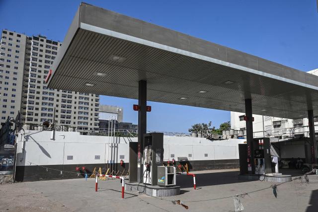 A general view shows a closed fuel station in Karachi on March 7, 2026. Crude prices surged March 6 on mounting fears about oil supply disruption during the Middle East war, while equities retreated on poor US hiring data. (Photo by Rizwan TABASSUM / AFP)