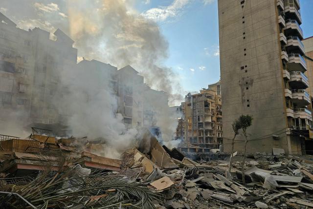 Smoke rises from the rubble of destroyed buildings at the site of an Israeli airstrike that targeted Haret Hreik neighbourhood in Beirut's southern suburbs, on March 7, 2026. Lebanese official media reported on March 7 that clashes had erupted as Israeli forces attempted a landing operation along the Lebanon-Syria border, with militant group Hezbollah saying its fighters were involved. There was no immediate comment from the Israeli military, which has launched numerous strikes and sent ground troops into Lebanon since Tehran-backed group Hezbollah fired missiles at Israel on March 2 to avenge the killing of Iranian supreme leader Ali Khamenei. (Photo by AFP)
