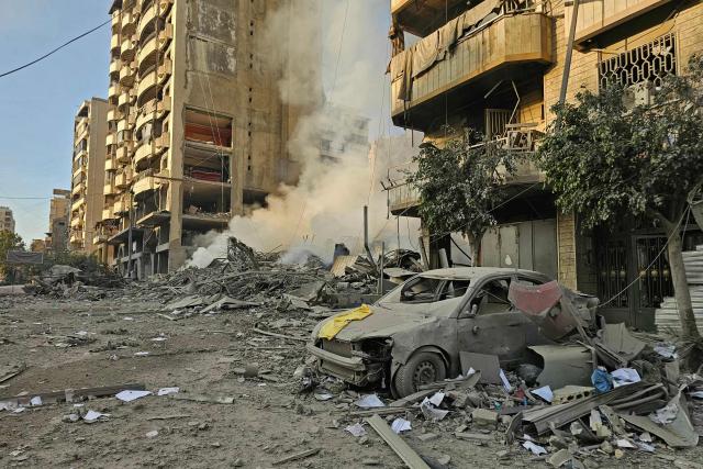 Smoke rises from the rubble of destroyed buildings at the site of an Israeli airstrike that targeted Haret Hreik neighbourhood in Beirut's southern suburbs, on March 7, 2026. Lebanese official media reported on March 7 that clashes had erupted as Israeli forces attempted a landing operation along the Lebanon-Syria border, with militant group Hezbollah saying its fighters were involved. There was no immediate comment from the Israeli military, which has launched numerous strikes and sent ground troops into Lebanon since Tehran-backed group Hezbollah fired missiles at Israel on March 2 to avenge the killing of Iranian supreme leader Ali Khamenei. (Photo by AFP)