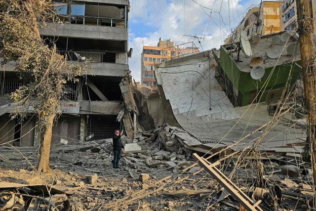 A man inspects the debris of destroyed buildings at the site of an Israeli airstrike that targeted Haret Hreik neighbourhood in Beirut's southern suburbs, on March 7, 2026. Lebanese official media reported on March 7 that clashes had erupted as Israeli forces attempted a landing operation along the Lebanon-Syria border, with militant group Hezbollah saying its fighters were involved. There was no immediate comment from the Israeli military, which has launched numerous strikes and sent ground troops into Lebanon since Tehran-backed group Hezbollah fired missiles at Israel on March 2 to avenge the killing of Iranian supreme leader Ali Khamenei. (Photo by AFP)
