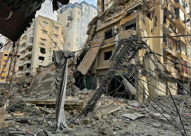 Rubble of destroyed buildings is seen at the site of an Israeli airstrike that targeted Haret Hreik neighbourhood in Beirut's southern suburbs, on March 7, 2026. Lebanese official media reported on March 7 that clashes had erupted as Israeli forces attempted a landing operation along the Lebanon-Syria border, with militant group Hezbollah saying its fighters were involved. There was no immediate comment from the Israeli military, which has launched numerous strikes and sent ground troops into Lebanon since Tehran-backed group Hezbollah fired missiles at Israel on March 2 to avenge the killing of Iranian supreme leader Ali Khamenei. (Photo by AFP)