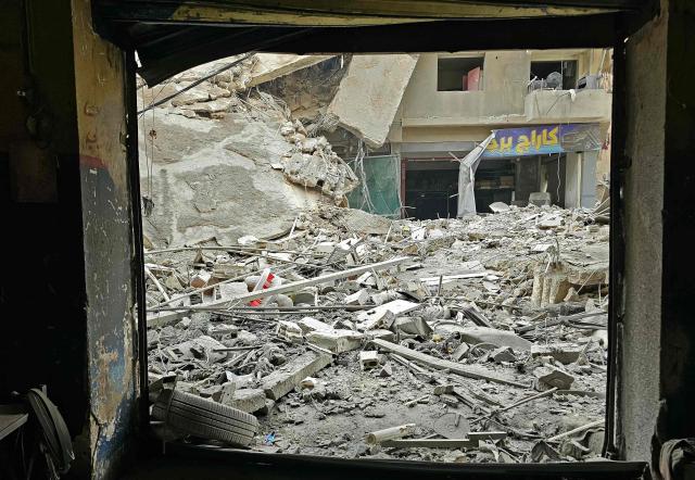 Rubble of destroyed buildings is seen at the site of an Israeli airstrike that targeted Haret Hreik neighbourhood in Beirut's southern suburbs, on March 7, 2026. Lebanese official media reported on March 7 that clashes had erupted as Israeli forces attempted a landing operation along the Lebanon-Syria border, with militant group Hezbollah saying its fighters were involved. There was no immediate comment from the Israeli military, which has launched numerous strikes and sent ground troops into Lebanon since Tehran-backed group Hezbollah fired missiles at Israel on March 2 to avenge the killing of Iranian supreme leader Ali Khamenei. (Photo by AFP)