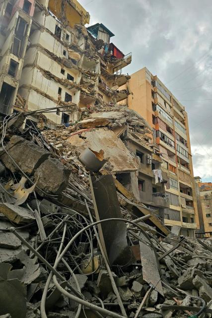 Rubble of destroyed buildings is seen at the site of an Israeli airstrike that targeted Haret Hreik neighbourhood in Beirut's southern suburbs, on March 7, 2026. Lebanese official media reported on March 7 that clashes had erupted as Israeli forces attempted a landing operation along the Lebanon-Syria border, with militant group Hezbollah saying its fighters were involved. There was no immediate comment from the Israeli military, which has launched numerous strikes and sent ground troops into Lebanon since Tehran-backed group Hezbollah fired missiles at Israel on March 2 to avenge the killing of Iranian supreme leader Ali Khamenei. (Photo by AFP)