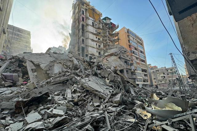 Rubble of destroyed buildings is seen at the site of an Israeli airstrike that targeted Haret Hreik neighbourhood in Beirut's southern suburbs, on March 7, 2026. Lebanese official media reported on March 7 that clashes had erupted as Israeli forces attempted a landing operation along the Lebanon-Syria border, with militant group Hezbollah saying its fighters were involved. There was no immediate comment from the Israeli military, which has launched numerous strikes and sent ground troops into Lebanon since Tehran-backed group Hezbollah fired missiles at Israel on March 2 to avenge the killing of Iranian supreme leader Ali Khamenei. (Photo by AFP)