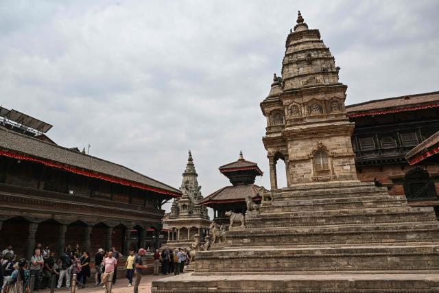 People visit the Durbar Square in Bhaktapur near Kathmandu on March 7, 2026. Nepal's centrist party of rapper-turned-politician Balendra Shah looked set to win by a landslide in parliamentary polls, according to Election Commission trends March 7, but with counting still far to go. (Photo by Tauseef MUSTAFA / AFP)