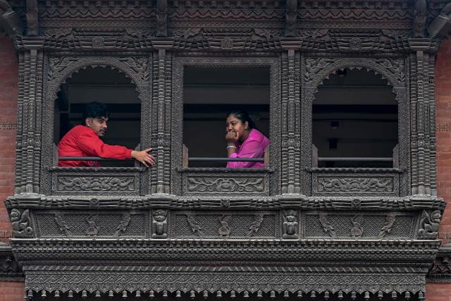 People sit at a restaurant at Durbar Square in Bhaktapur near Kathmandu on March 7, 2026. Nepal's centrist party of rapper-turned-politician Balendra Shah looked set to win by a landslide in parliamentary polls, according to Election Commission trends March 7, but with counting still far to go. (Photo by Tauseef MUSTAFA / AFP)
