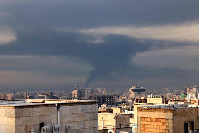Smoke rises from the site of airstrikes in Tehran on March 7, 2026. Loud explosions struck the Iranian capital on March 7, state TV reported, as the war with Israel and the United States entered its second week. (Photo by ATTA KENARE / AFP)