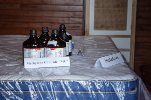 Evidence remains at the crime scene as Russian national suspects  S.T. (not pictured) and Natalia (not pictured), both accused of operating a laboratory producing the synthetic drug mephedrone, are brought to the house used to manufacture drugs during a crime scene reconstruction as authorities search for another foreign suspect in Gianyar, on Indonesia's resort island of Bali on March 7, 2026. (Photo by LANA PRIATNA / AFP)