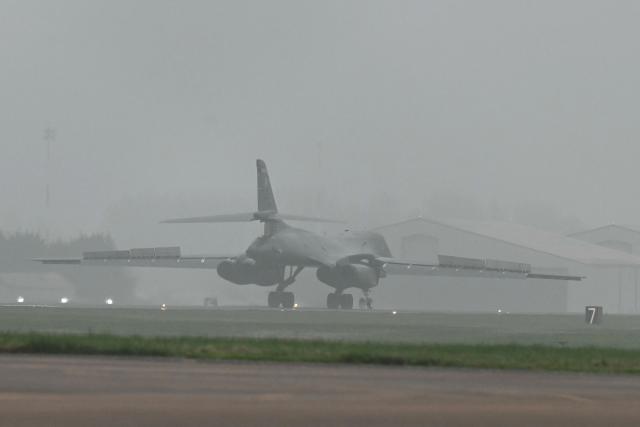 A US Air Force B-1 Lancer bomber lands at RAF Fairford in south west England on March 7, 2026. Britain's Prime Minister Keir Starmer has given approval for Washington to use the bases of Diego Garcia in the Indian Ocean and RAF Fairford in south-west England to bomb Iranian missile sites, after several Gulf countries were targeted by Iranian retaliations. (Photo by JUSTIN TALLIS / AFP)