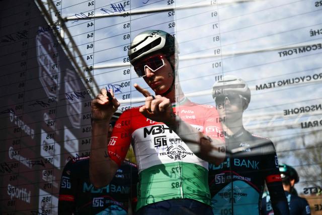 MBH Bank CSB Telecom Fort MBH's Hungarian Marton Dina signs ahead of the 20th one-day classic 'Strade Bianche' (White Roads) men's cycling race between Siena and Siena in Tuscany on March 7, 2026. (Photo by Marco BERTORELLO / AFP)
