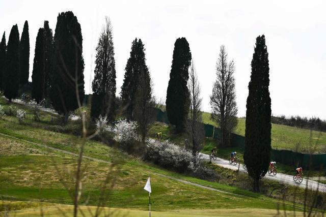 The pack rides during the 20th one-day classic 'Strade Bianche' (White Roads) men's cycling race between Siena and Siena in Tuscany on March 7, 2026. (Photo by Marco BERTORELLO / AFP)