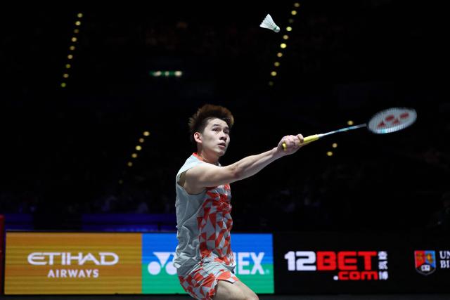 Thailand's Kunlavut Vitidsarn returns against Taiwan's Lin Chun-yi during their men's singles semi-final at the All England Open Badminton Championships at the Utilita Arena in Birmingham, central England, on March 7, 2026. (Photo by Darren Staples / AFP)