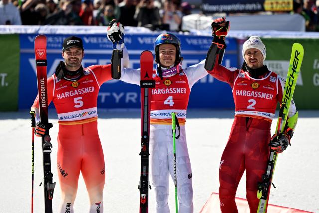 (From L) Second-placed Switzerland's Loic Meillard, winner Brazil's Lucas Pinheiro Braathen and Austria's Stefan Brennsteiner celebrate after competing in the Men's Giant Slalom event, part of FIS Alpine Ski World Cup 2025-2026 in Kranjska Gora, Slovenia, on March 7, 2026. (Photo by JURE MAKOVEC / AFP)