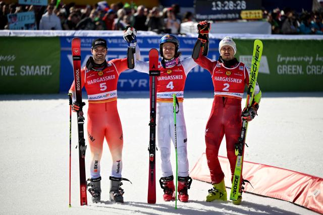 (From L) Second-placed Switzerland's Loic Meillard, winner Brazil's Lucas Pinheiro Braathen and Austria's Stefan Brennsteiner celebrate after competing in the Men's Giant Slalom event, part of FIS Alpine Ski World Cup 2025-2026 in Kranjska Gora, Slovenia, on March 7, 2026. (Photo by JURE MAKOVEC / AFP)