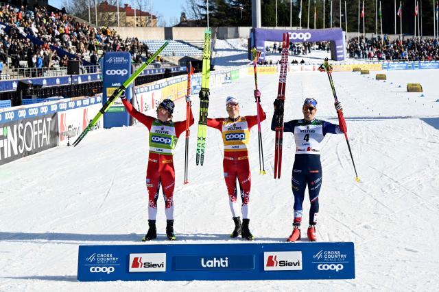 (L-R) Second-placed Lars Heggen of Norway, winner Johannes Hoesflot Klaebo of Norway and third-placed Jules Chappaz of France celebrate on the podium after the Cross-Country Skiing Men's Sprint Free Style final at the FIS Nordic World Cup Lahti Ski Games in Lahti, Finland, on March 7, 2026. (Photo by Emmi Korhonen / Lehtikuva / AFP) / Finland OUT