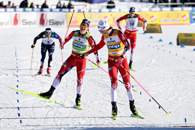 The winner Johannes Hoesflot Klaebo (R) of Norway and his second placed compatriot Lars Heggen react after crossing the finnish line of the Cross-Country Skiing Men's Sprint Free Style final at the FIS Nordic World Cup Lahti Ski Games in Lahti, Finland, on March 7, 2026. (Photo by Emmi Korhonen / Lehtikuva / AFP) / Finland OUT