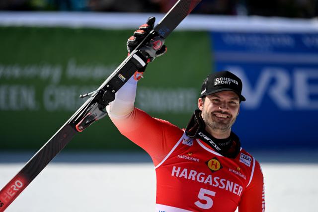 Switzerland's Loic Meillard celebrates after finishing second at the end of the Men's Giant Slalom event, part of FIS Alpine Ski World Cup 2025-2026 in Kranjska Gora, Slovenia, on March 7, 2026. (Photo by JURE MAKOVEC / AFP)