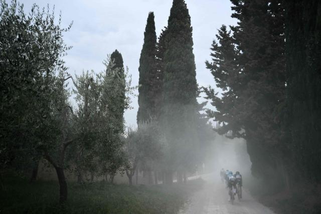The pack rides during the 20th one-day classic 'Strade Bianche' (White Roads) men's cycling race between Siena and Siena in Tuscany on March 7, 2026. (Photo by Marco BERTORELLO / AFP)