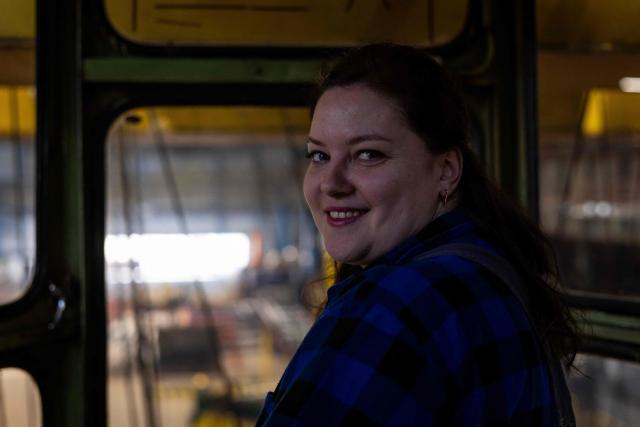 Nadia Bogomal, 37 years old Ukrainian and overhead crane operator, works from the cabin of her crane in the production hall of the Gdansk Shipyard in Gdansk, Poland, on March 6, 2026. "Around 70% of crane operators on construction sites today are women," according to a worker at the shipyard, a tradition inherited from the communist era. The shipyard, known as the birthplace of the Solidarnosc trade union that led to the fall of communism in Poland in 1989, still builds some ships but today, mainly wind turbines are produced at the site. (Photo by Wojtek RADWANSKI / AFP)