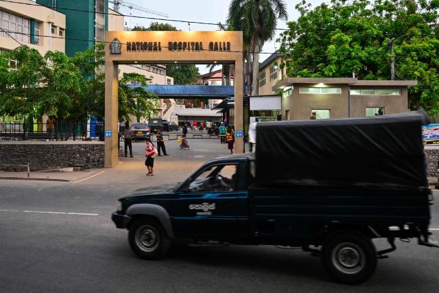 A Sri Lankan police truck drives past the Karapitiya hospital in the southern city of Galle on March 7, 2026 where the rescued Iranian sailors are being treated. Sri Lanka will treat Iranian sailors rescued from a torpedoed frigate according to international law, a minister said on March 7, following reports Washington was pressuring Colombo to not repatriate them. (Photo by Ishara S. KODIKARA / AFP)