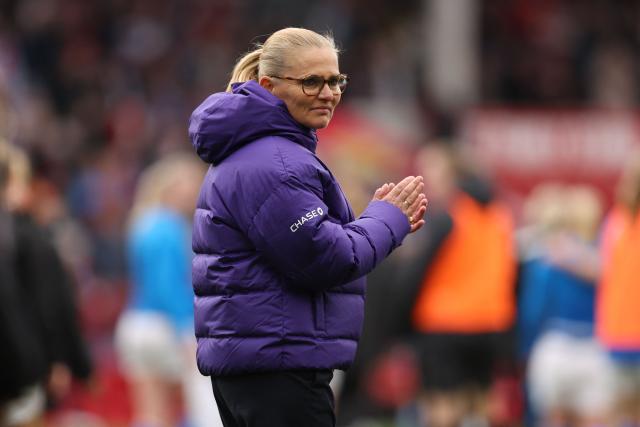 England's Dutch head coach Sarina Wiegman applauds fans on the pitch after the Women's FIFA world cup league A, group 3, qualifier football match between England and Iceland at The City Ground in Nottingham, central England on March 7, 2026. England won the game 2-0. (Photo by Chris RADBURN / AFP)