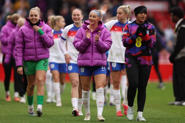 England's players applaud fans on the pitch after the Women's FIFA world cup league A, group 3, qualifier football match between England and Iceland at The City Ground in Nottingham, central England on March 7, 2026. England won the game 2-0. (Photo by Chris RADBURN / AFP)