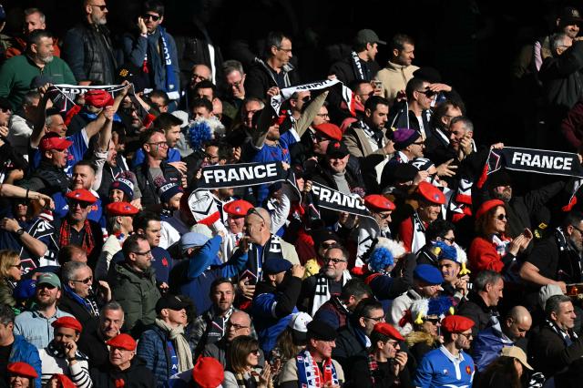 French fans cheer on their team during the Six Nations international rugby union match between Scotland and France at Murrayfield Stadium in Edinburgh, Scotland on March 7, 2026. (Photo by Paul ELLIS / AFP)