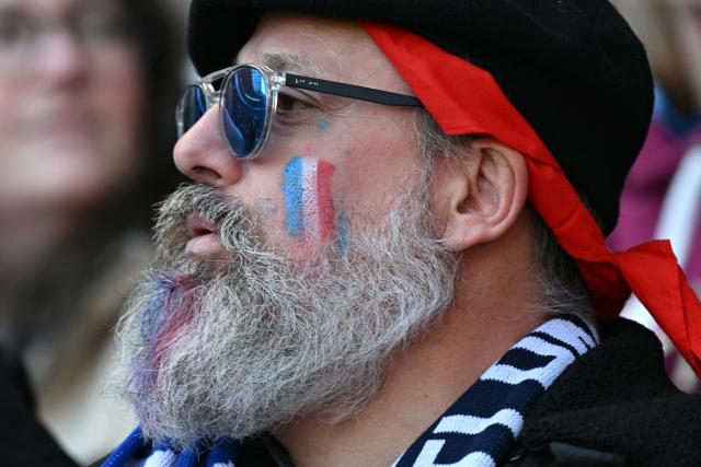 A French fan waits for kick-off in the Six Nations international rugby union match between Scotland and France at Murrayfield Stadium in Edinburgh, Scotland on March 7, 2026. (Photo by Paul ELLIS / AFP)
