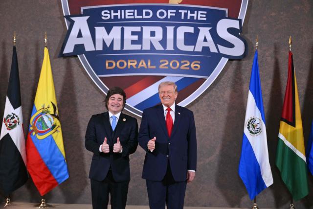 US President Donald Trump and Argentina's President Javier Milei (L) pose for a photo at the beginning of the "Shield of the Americas" Summit at Trump National Doral in Miami, Florida, March 7, 2026. President Trump is hosting a dozen right-wing leaders from Latin America and the Caribbean to discuss issues facing the region, from organized crime to illegal immigration. The summit also aims to serve Washington by boosting US interests in the region and curbing those from foreign powers like China. (Photo by SAUL LOEB / AFP)