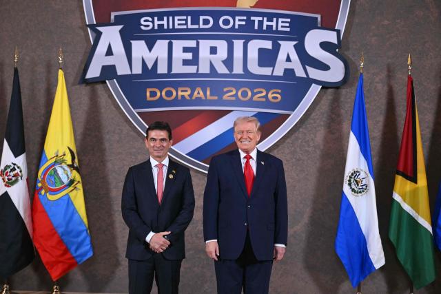 US President Donald Trump and Bolivia's President Rodrigo Paz Pereira (L) pose for a photo at the beginning of the "Shield of the Americas" Summit at Trump National Doral in Miami, Florida, March 7, 2026. President Trump is hosting a dozen right-wing leaders from Latin America and the Caribbean to discuss issues facing the region, from organized crime to illegal immigration. The summit also aims to serve Washington by boosting US interests in the region and curbing those from foreign powers like China. (Photo by SAUL LOEB / AFP)