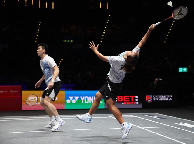 Taiwan’s Ye Hong Wei & Nicole Gonzales compete against China's Tang Chun Man & Tse Ying Suet during the mixed doubles semi-final at the All England Open Badminton Championships at the Utilita Arena in Birmingham, central England, on March 7, 2026. (Photo by Darren Staples / AFP)
