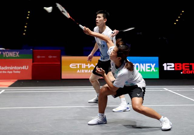 Taiwan’s Ye Hong Wei & Nicole Gonzales compete against China's Tang Chun Man & Tse Ying Suet during the mixed doubles semi-final at the All England Open Badminton Championships at the Utilita Arena in Birmingham, central England, on March 7, 2026. (Photo by Darren Staples / AFP)