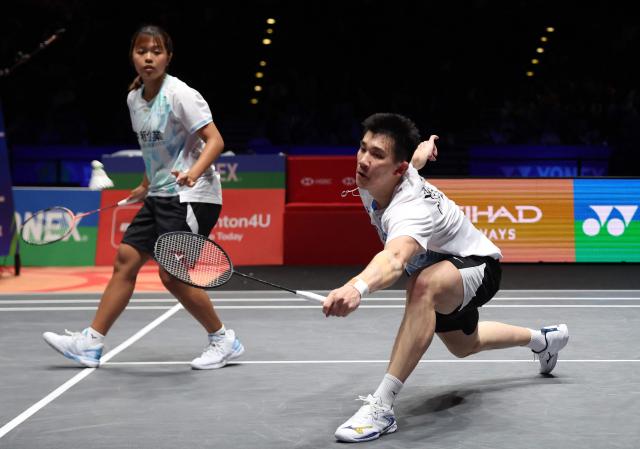 Taiwan’s Ye Hong Wei & Nicole Gonzales compete against China's Tang Chun Man & Tse Ying Suet during the mixed doubles semi-final at the All England Open Badminton Championships at the Utilita Arena in Birmingham, central England, on March 7, 2026. (Photo by Darren Staples / AFP)