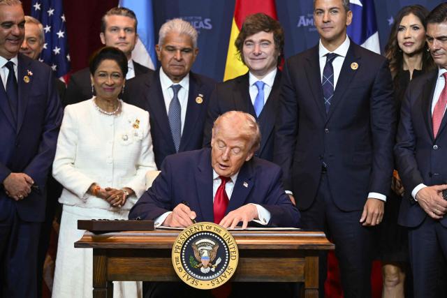 US President Donald Trump signs a proclamation at the "Shield of the Americas" Summit at Trump National Doral in Miami, Florida, March 7, 2026. President Trump is hosting a dozen right-wing leaders from Latin America and the Caribbean to discuss issues facing the region, from organized crime to illegal immigration. The summit also aims to serve Washington by boosting US interests in the region and curbing those from foreign powers like China. (Photo by SAUL LOEB / AFP)