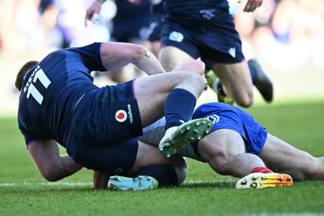 Scotland's wing Kyle Steyn is hurt trying to stop a try by France's scrum-half Antoine Dupont during the Six Nations international rugby union match between Scotland and France at Murrayfield Stadium in Edinburgh, Scotland on March 7, 2026. (Photo by Paul ELLIS / AFP)