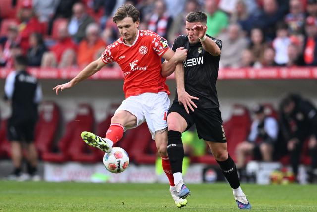 Mainz' German defender #04 Stefan Posch and Stuttgart's Bosnian forward #09 Ermedin Demirovic vie for the ball during the German first division Bundesliga football match between 1 FSV Mainz 05 and VfB Stuttgart in Mainz, western Germany on March 7, 2026. (Photo by Kirill KUDRYAVTSEV / AFP) / DFL REGULATIONS PROHIBIT ANY USE OF PHOTOGRAPHS AS IMAGE SEQUENCES AND/OR QUASI-VIDEO