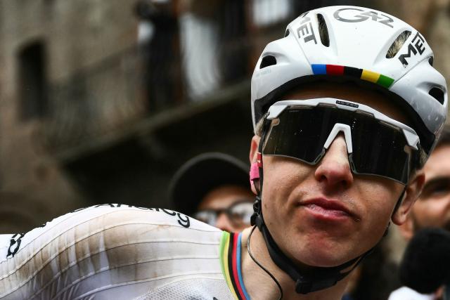 UAE Team Emirates's Slovenian Tadej Pogacar celebrates after winning the 20th one-day classic 'Strade Bianche' (White Roads) men's cycling race between Siena and Siena in Tuscany on March 7, 2026. (Photo by Marco BERTORELLO / AFP)