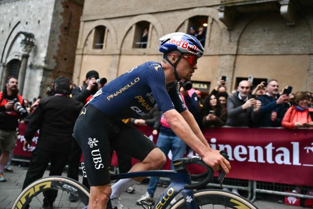 Pinarello-Q36.5 Pro Cycling Team PQT's British Thomas Pidcock rides after crossing the finish line of the 20th one-day classic 'Strade Bianche' (White Roads) men's cycling race between Siena and Siena in Tuscany on March 7, 2026. (Photo by Marco BERTORELLO / AFP)
