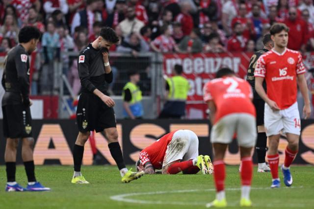 Players including Mainz' German forward #20 Phillip Tietz (C) react during the German first division Bundesliga football match between 1 FSV Mainz 05 and VfB Stuttgart in Mainz, western Germany on March 7, 2026. (Photo by Kirill KUDRYAVTSEV / AFP) / DFL REGULATIONS PROHIBIT ANY USE OF PHOTOGRAPHS AS IMAGE SEQUENCES AND/OR QUASI-VIDEO